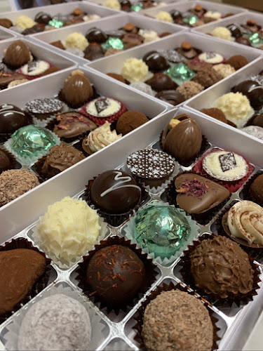 COQ AU VIN Chocolatière und Weinhandel